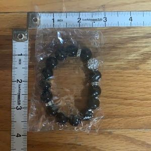 Simple black plastic beaded bracelet with crystal details